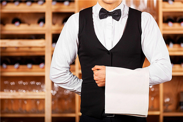 Why do waiters hold their hands behind their backs?