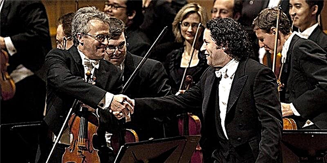 Why does the conductor shake hands at the first violin at concerts?