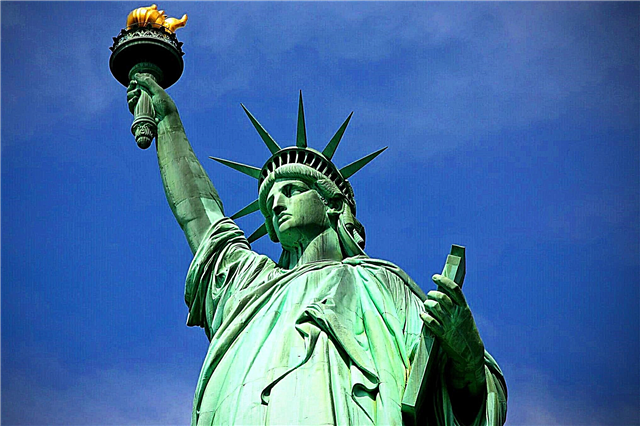 What book does the American Statue of Liberty hold?